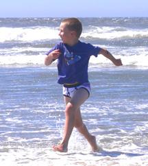 Kyle playing in ocean